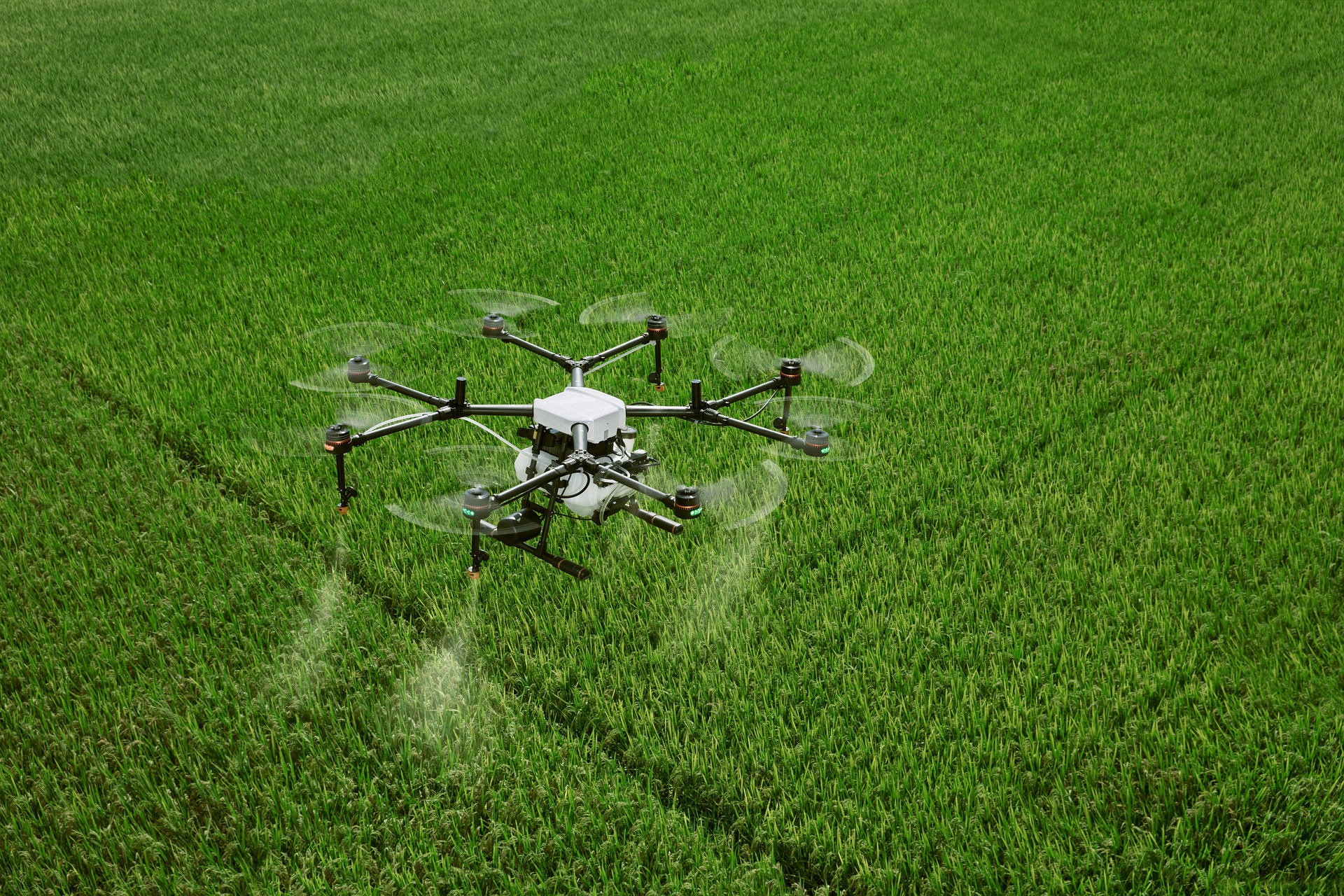 Photo of a drone flying above a farm field